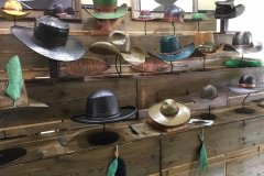 Hat display on handmade wooden shelving
