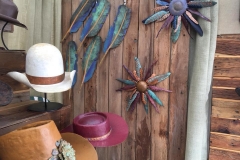 Copper feathers alongside steel hats